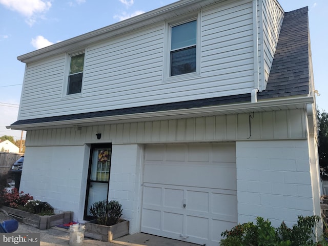 view of side of property featuring a garage