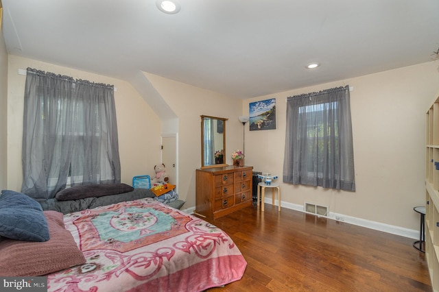 bedroom featuring dark hardwood / wood-style flooring