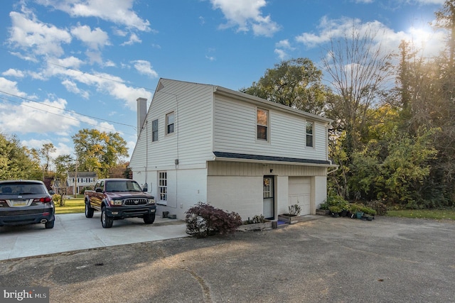 view of side of home featuring a garage