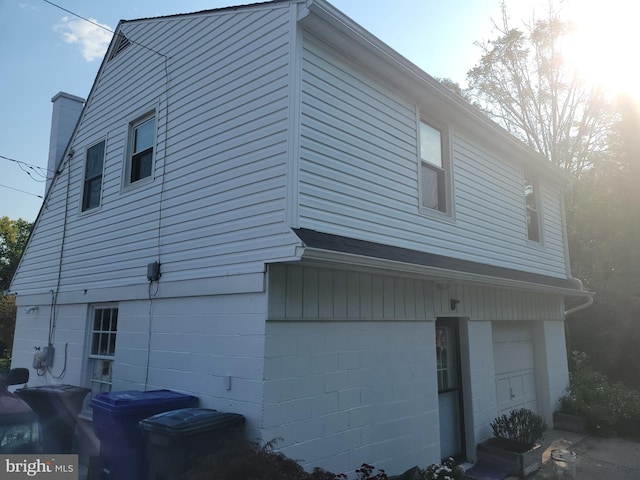 view of side of home featuring a garage