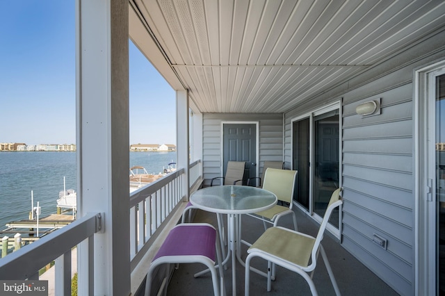 balcony featuring a water view