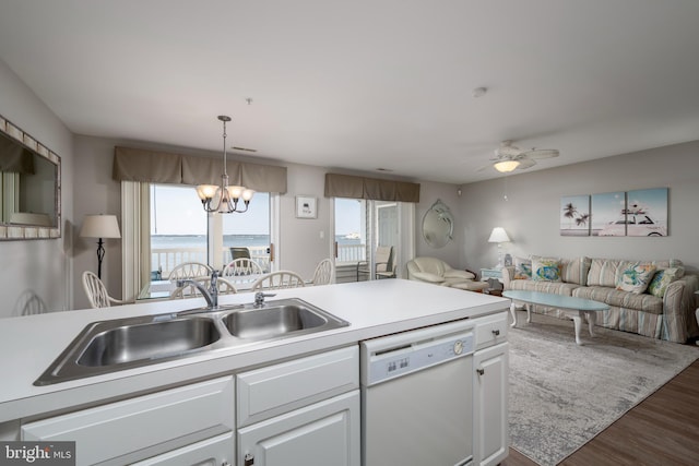 kitchen with dark hardwood / wood-style floors, white dishwasher, sink, white cabinetry, and ceiling fan with notable chandelier