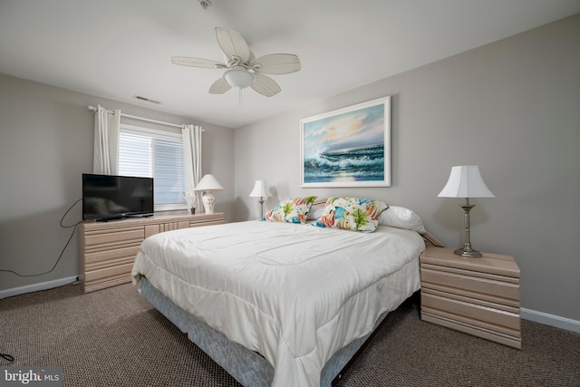 bedroom featuring ceiling fan and dark carpet