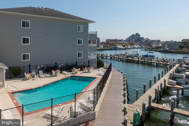 exterior space with a patio area and a water view