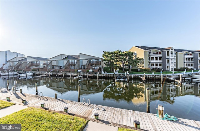 dock area featuring a water view