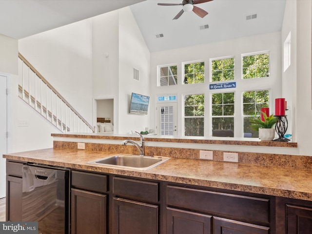 kitchen with black dishwasher, sink, dark brown cabinets, and high vaulted ceiling