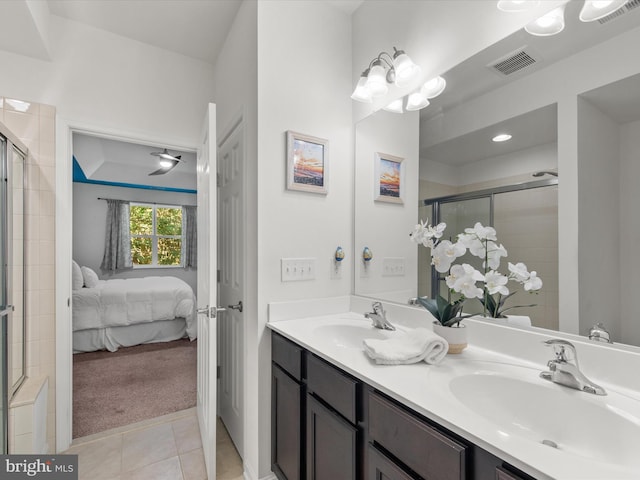 bathroom featuring vanity, tile patterned flooring, and an enclosed shower