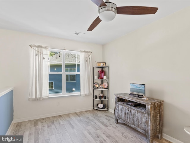 interior space featuring light wood-type flooring and ceiling fan