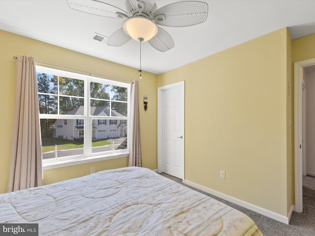 carpeted bedroom featuring ceiling fan