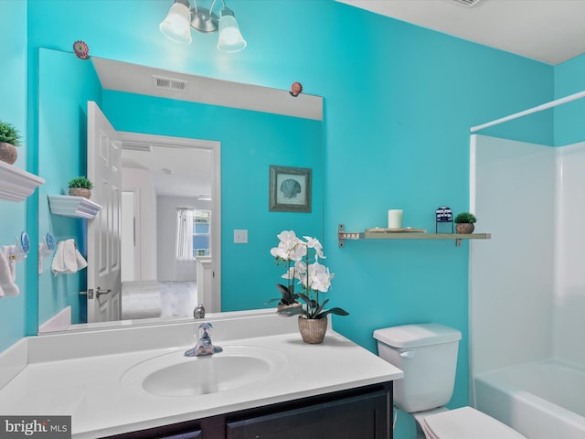 full bathroom featuring vanity, toilet, and shower / bath combination