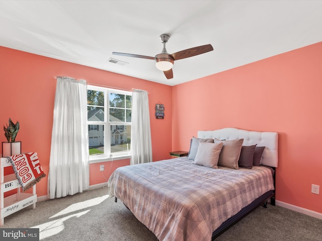 bedroom featuring ceiling fan and carpet