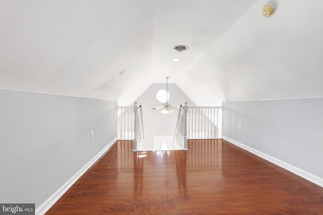 additional living space featuring ceiling fan, lofted ceiling, and dark hardwood / wood-style floors