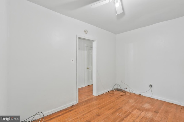 unfurnished room featuring light wood-type flooring and ceiling fan