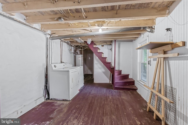 basement with washer / dryer, water heater, and dark hardwood / wood-style flooring