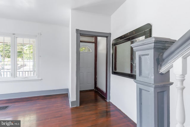 interior space with dark hardwood / wood-style flooring