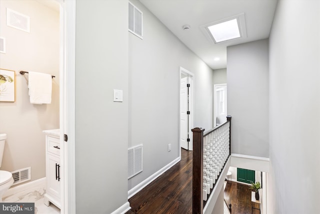 hallway featuring dark hardwood / wood-style floors