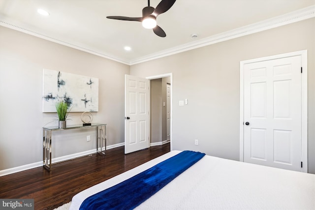 bedroom with crown molding, ceiling fan, and dark hardwood / wood-style flooring