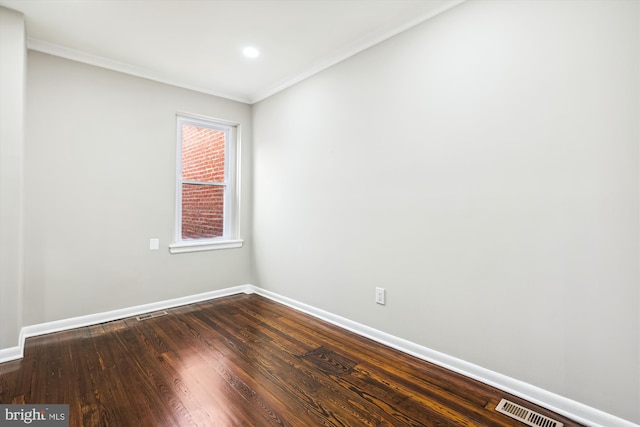 unfurnished room with crown molding and hardwood / wood-style floors