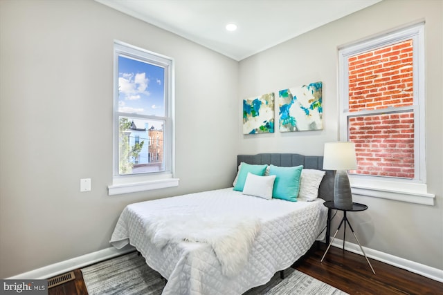 bedroom with hardwood / wood-style flooring