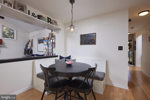 dining space with breakfast area and light wood-type flooring