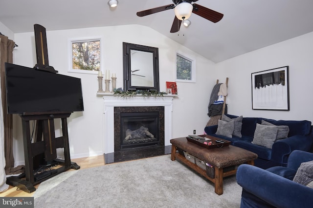 living room featuring ceiling fan and lofted ceiling