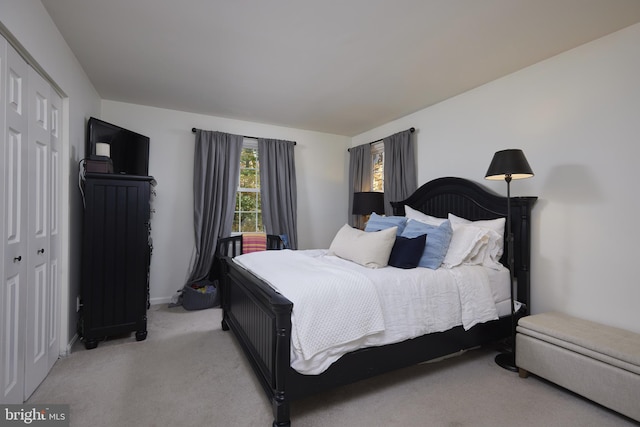 carpeted bedroom with a closet