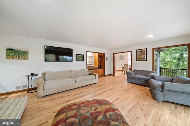 living room with light hardwood / wood-style flooring