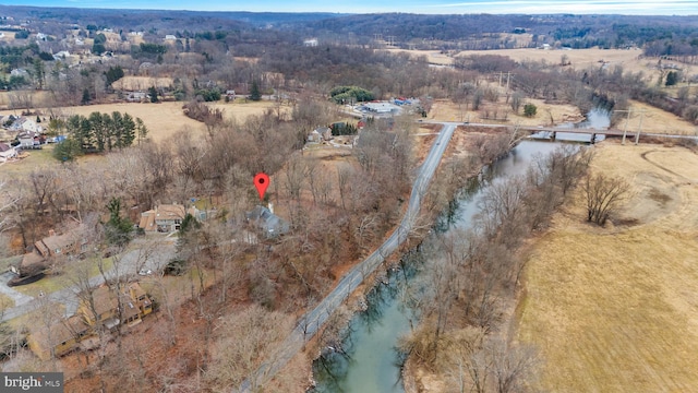 aerial view with a rural view and a water view