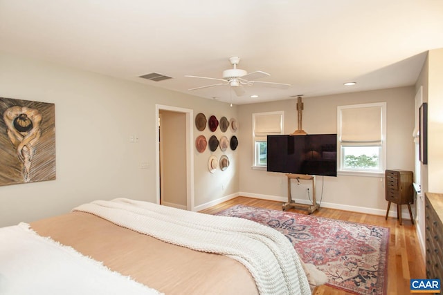 bedroom featuring light hardwood / wood-style floors and ceiling fan