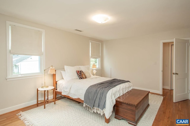 bedroom featuring wood-type flooring