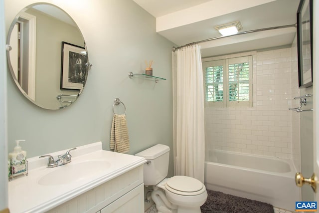 full bathroom featuring toilet, shower / bathtub combination with curtain, and vanity