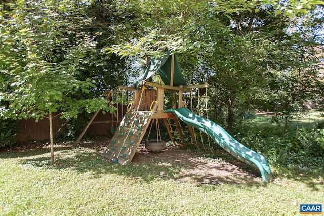 view of playground with a lawn