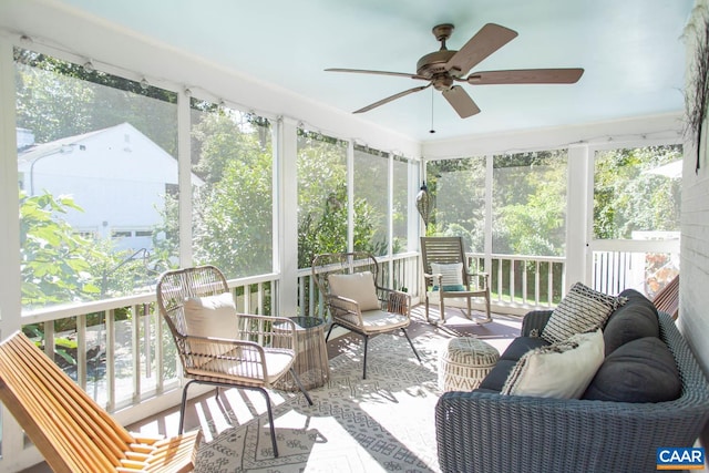 sunroom with plenty of natural light and ceiling fan