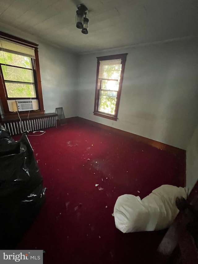 empty room featuring a wealth of natural light and cooling unit