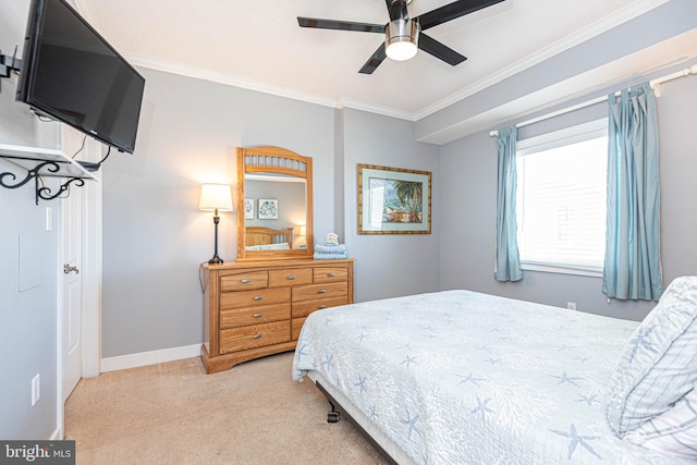 bedroom with ceiling fan, ornamental molding, and carpet floors