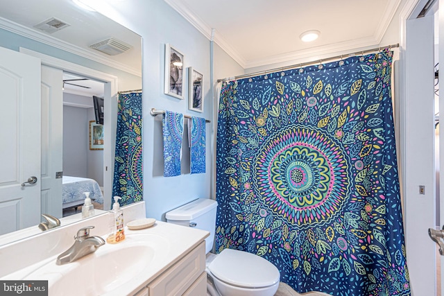 bathroom featuring vanity, ornamental molding, and toilet