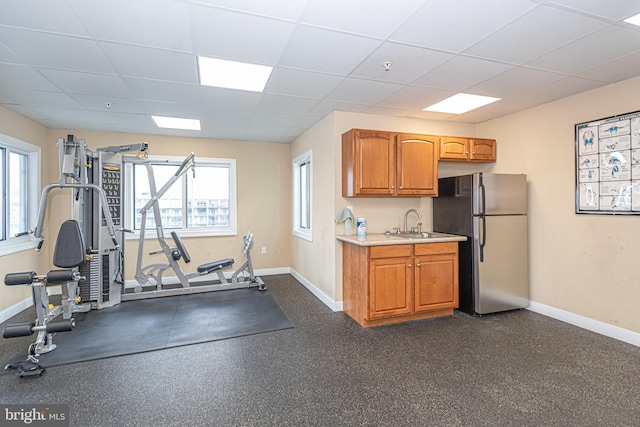 interior space with sink and a drop ceiling