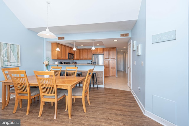 dining room featuring light wood-type flooring