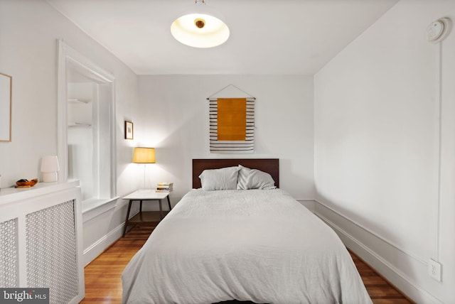 bedroom featuring hardwood / wood-style flooring