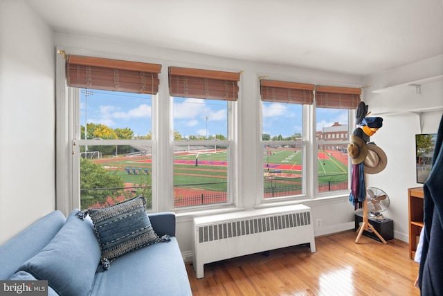 sunroom / solarium featuring radiator