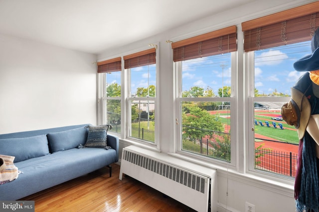 sunroom / solarium with a wealth of natural light and radiator