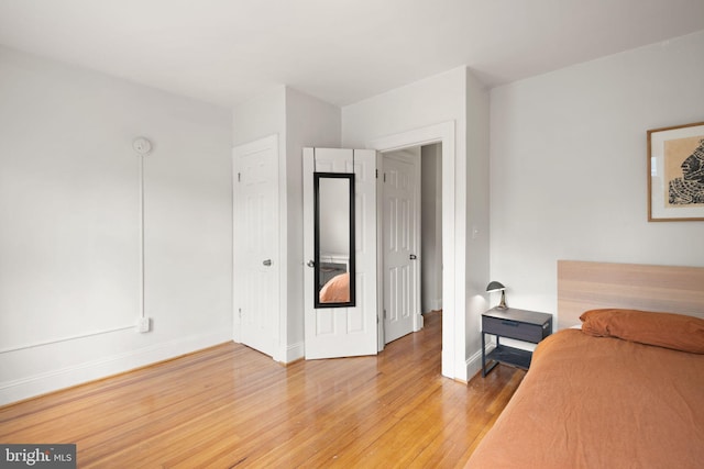 unfurnished bedroom with light wood-type flooring