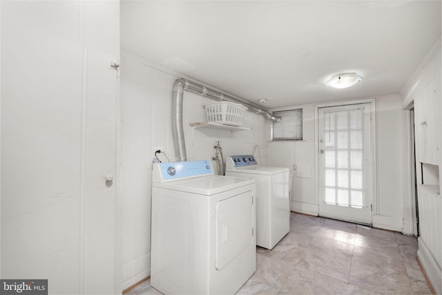 laundry room featuring washer and clothes dryer