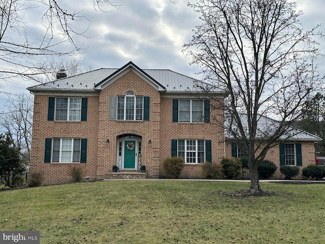 colonial-style house with a front yard