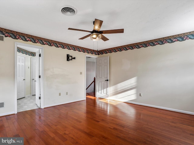 spare room with ceiling fan and light wood-type flooring