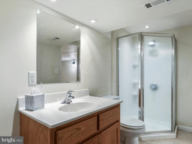 bathroom with walk in shower, vanity, toilet, and tile patterned flooring