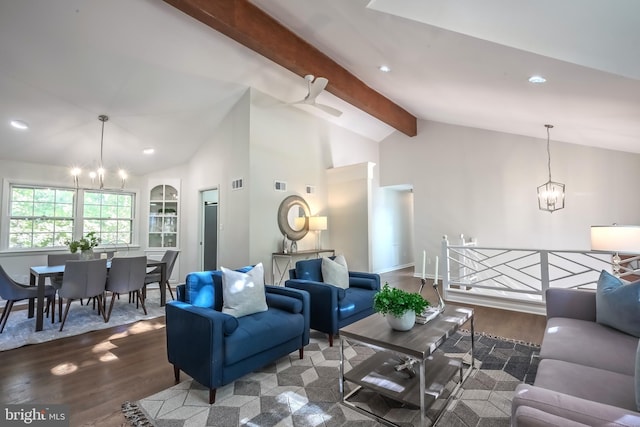 living room with vaulted ceiling with beams, wood-type flooring, and ceiling fan with notable chandelier