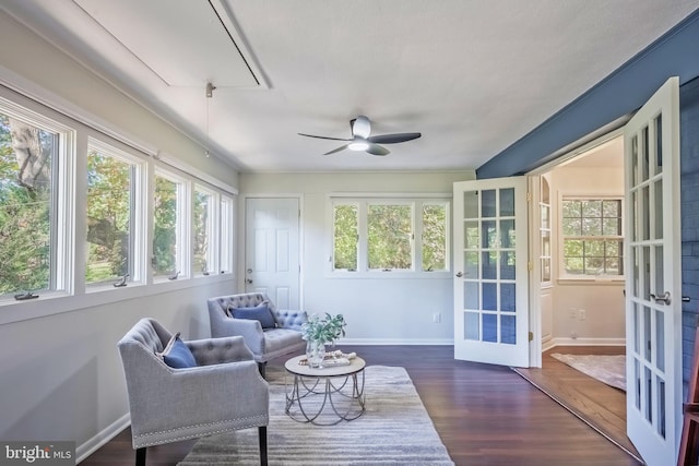 sunroom / solarium featuring french doors, plenty of natural light, and ceiling fan