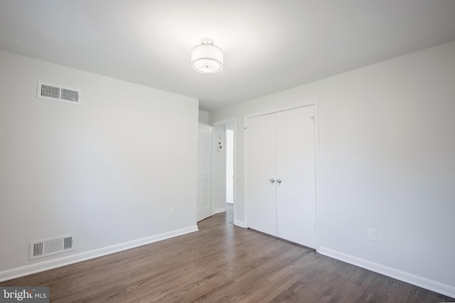 empty room featuring hardwood / wood-style floors