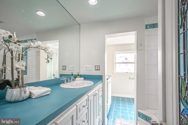 bathroom with vanity and tile patterned flooring